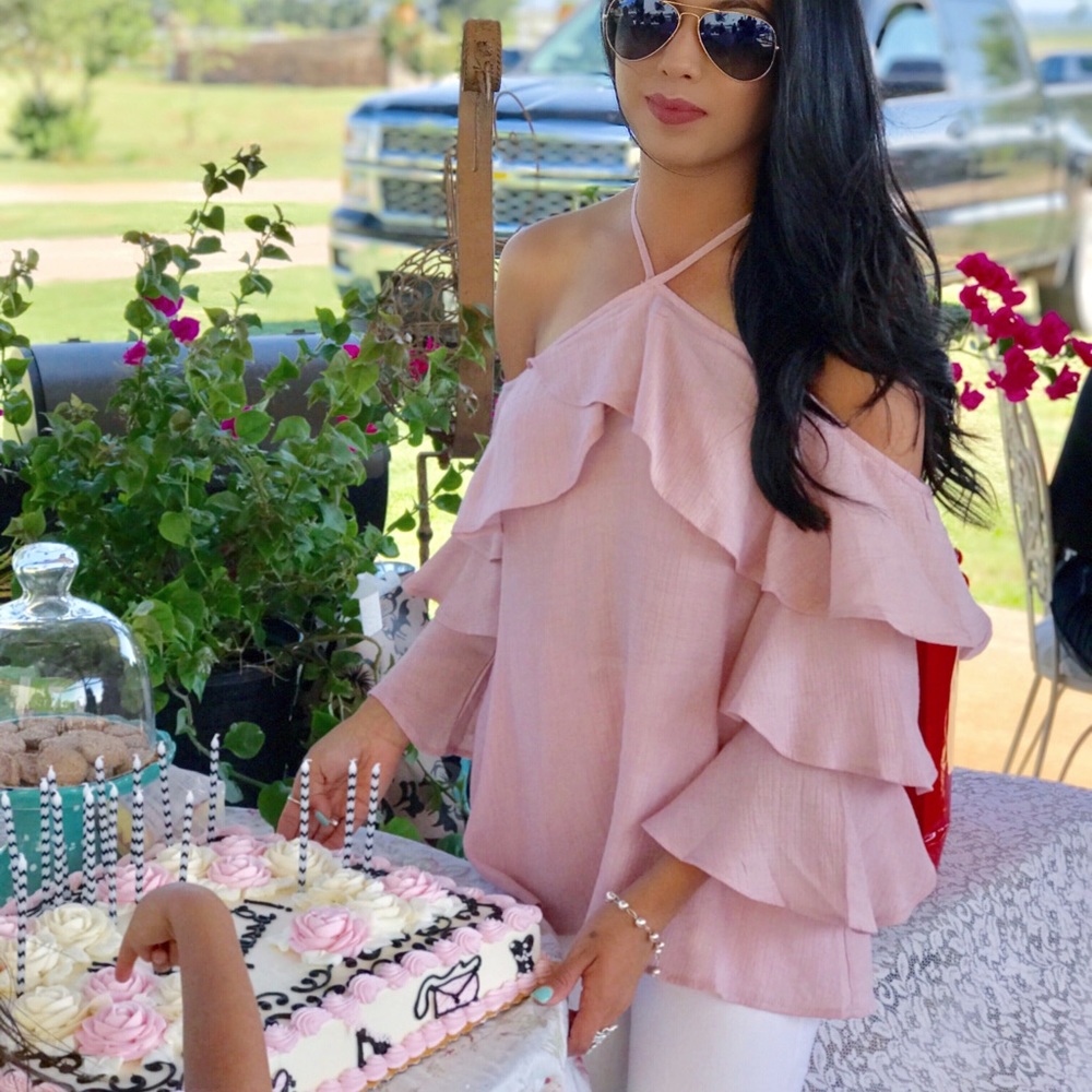Soft pink top with ruffle sleeves